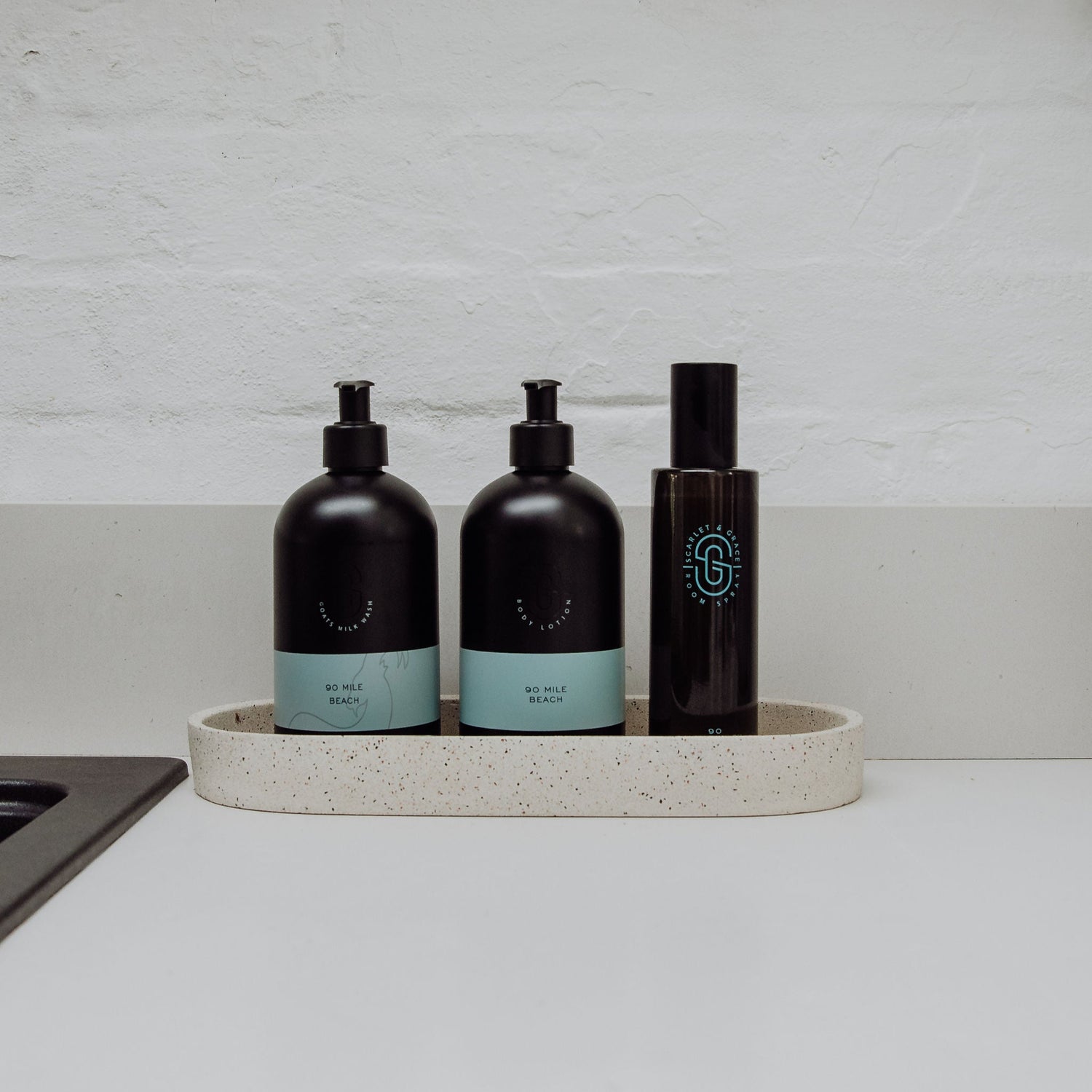 Opening the cap of Scarlet & Grace 200ml 90 Mile Beach room spray — vegan, cruelty-free Australian home fragrance
