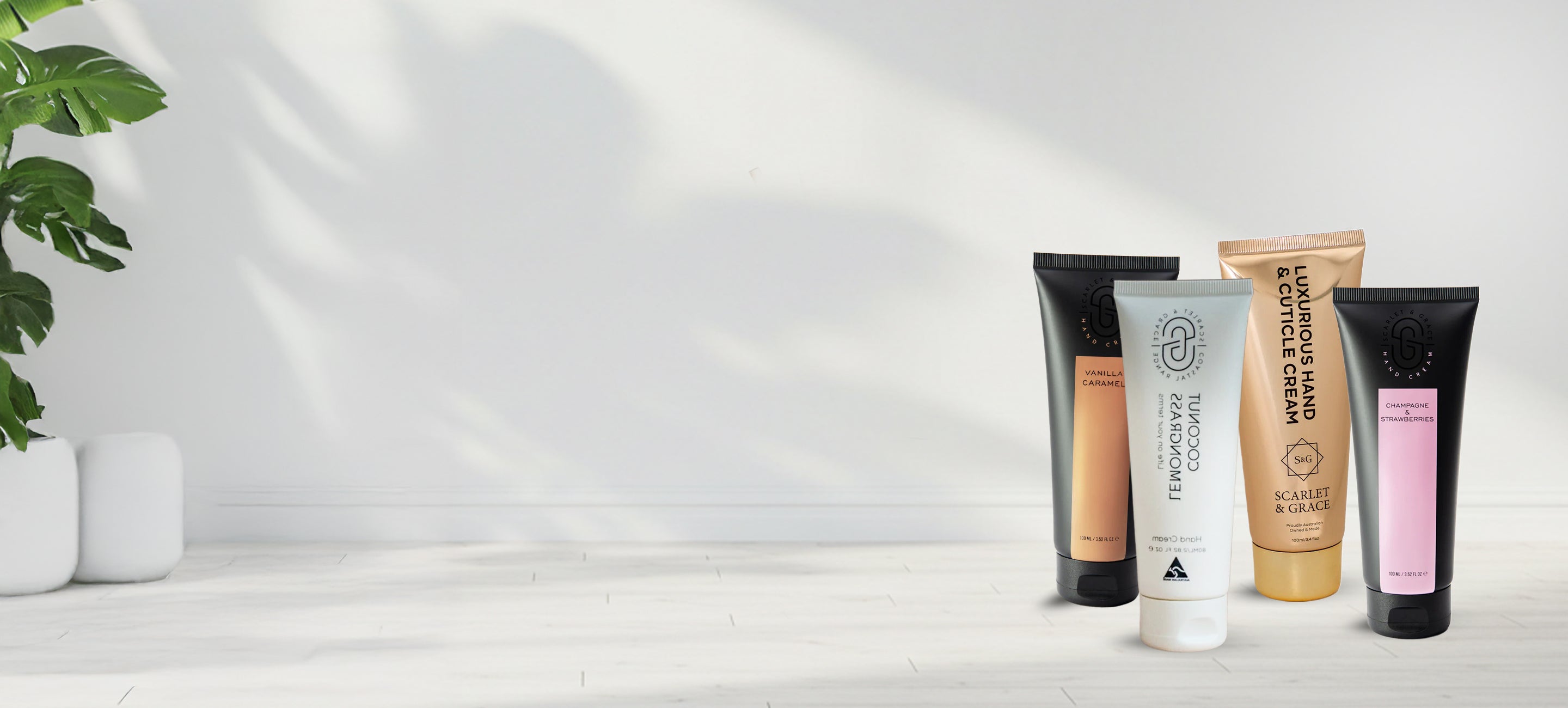 Set of skincare products on a white surface with a minimal background