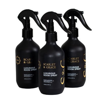 Woman holding Scarlet & Grace 250ml luxurious room spray — vegan, BPA-free and cruelty-free long-lasting room spray
